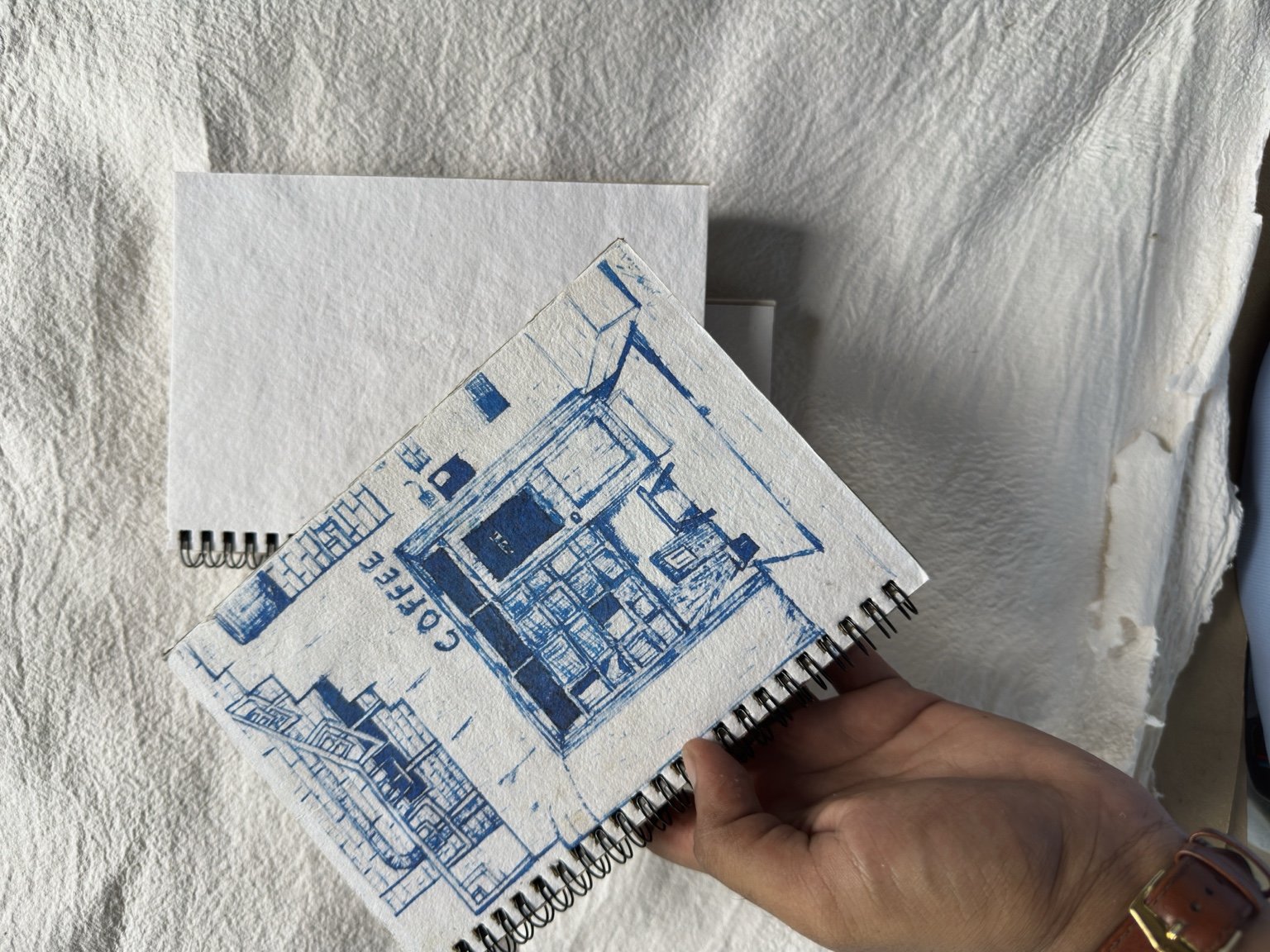 A printed notebook cover on handmade paper